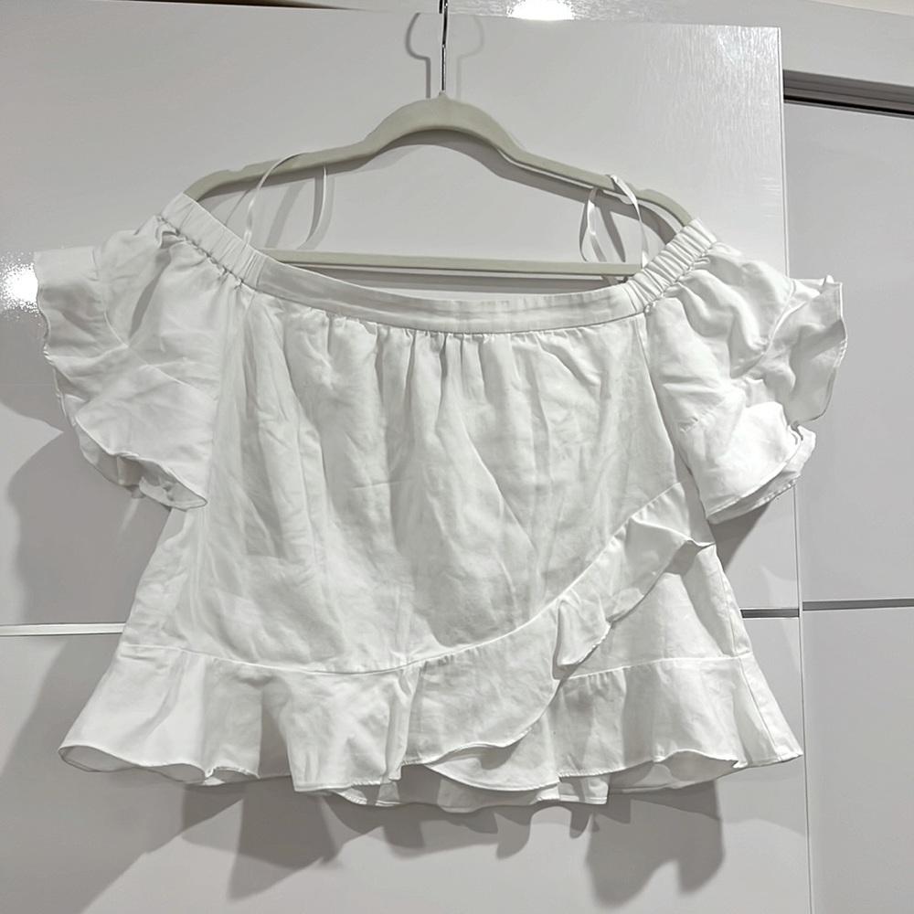 White off the shoulders short sleeve shirt. Size Medium
